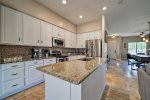 Large open kitchen with granite counter tops and stainless steel appliances